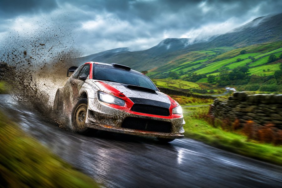Rally car on a wet hillside road